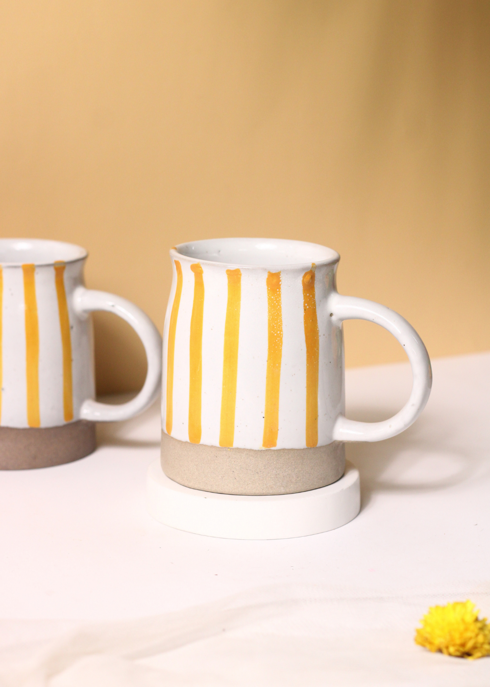 handmade yellow striped mug made by ceramic 