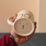 Bunny designed coffee mug in hand 