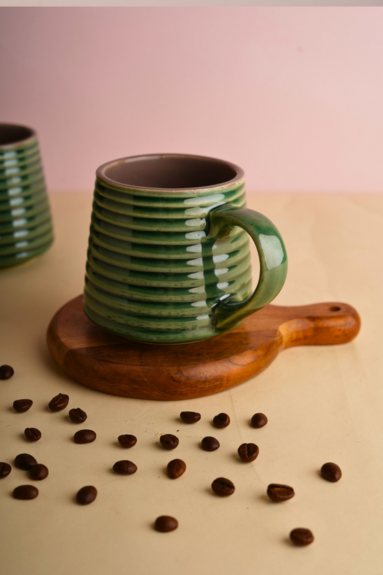 Handmade coffee mug with beans 