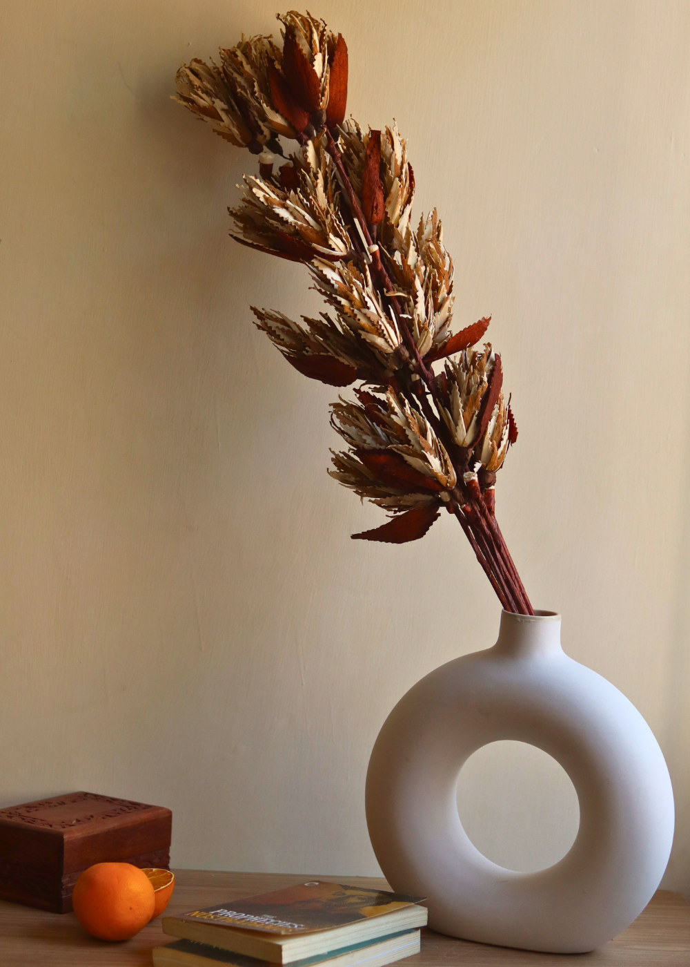 Dried flowers in white vase 