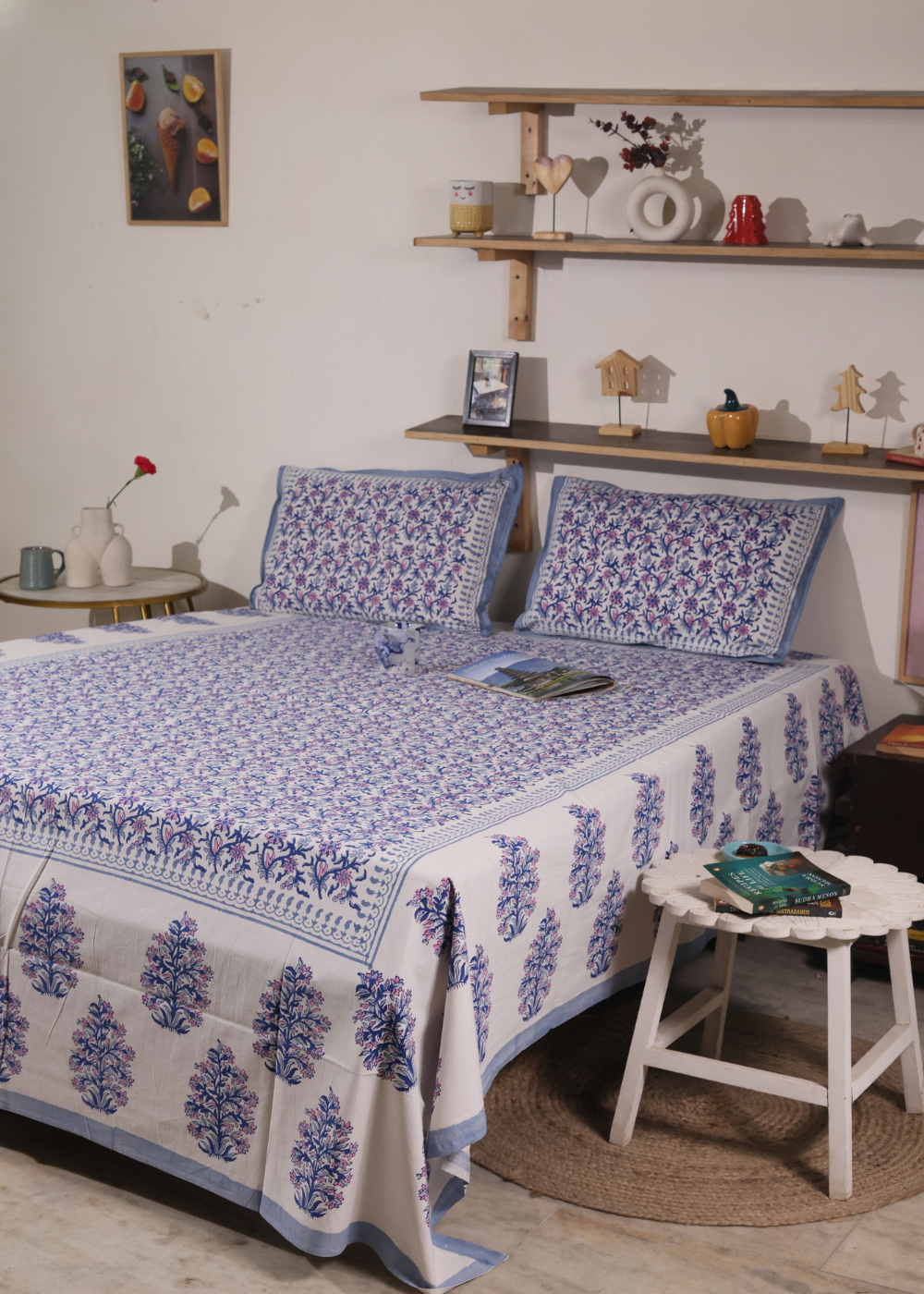 A systematic room with a beautiful block printed bedsheet