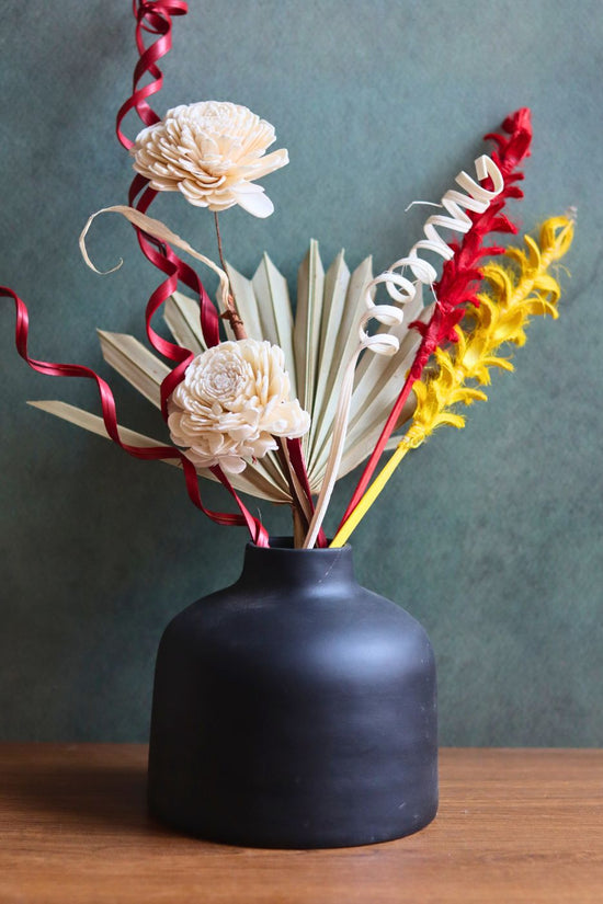 Handmade black round vase with assorted bunch combo