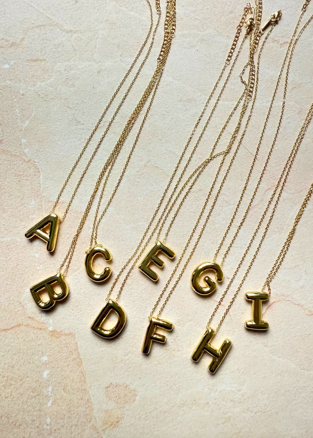Initial Necklaces with golden color