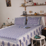 Blue and purple floral bedsheet with pillow