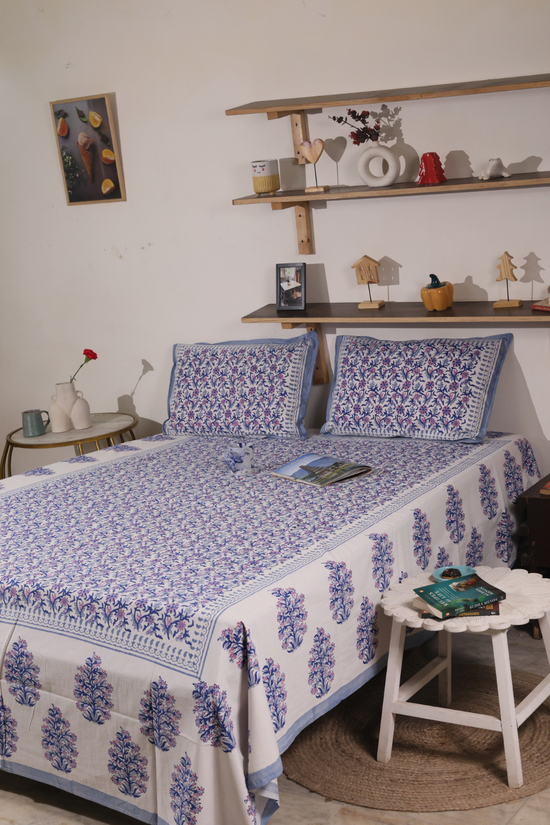 Blue and purple floral bedsheet with pillow