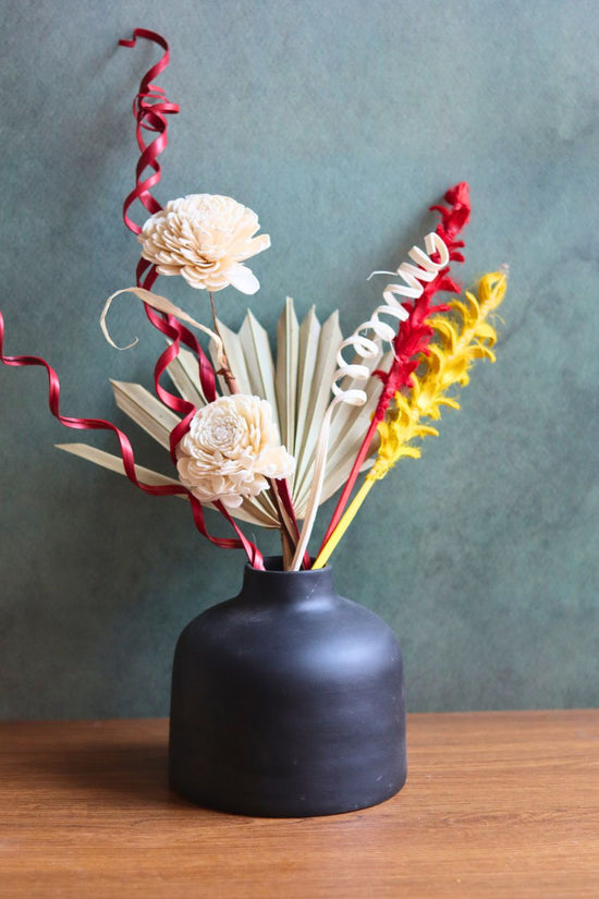 black round vase with assorted bunch combo made by handcrafted
