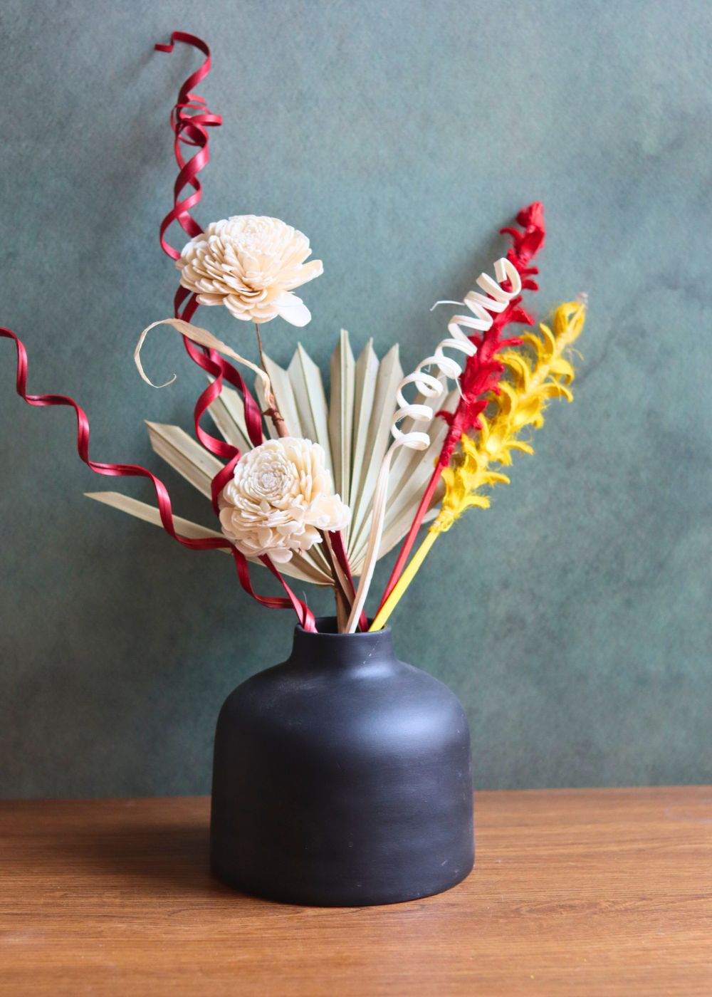 black round vase with assorted bunch combo made by handcrafted