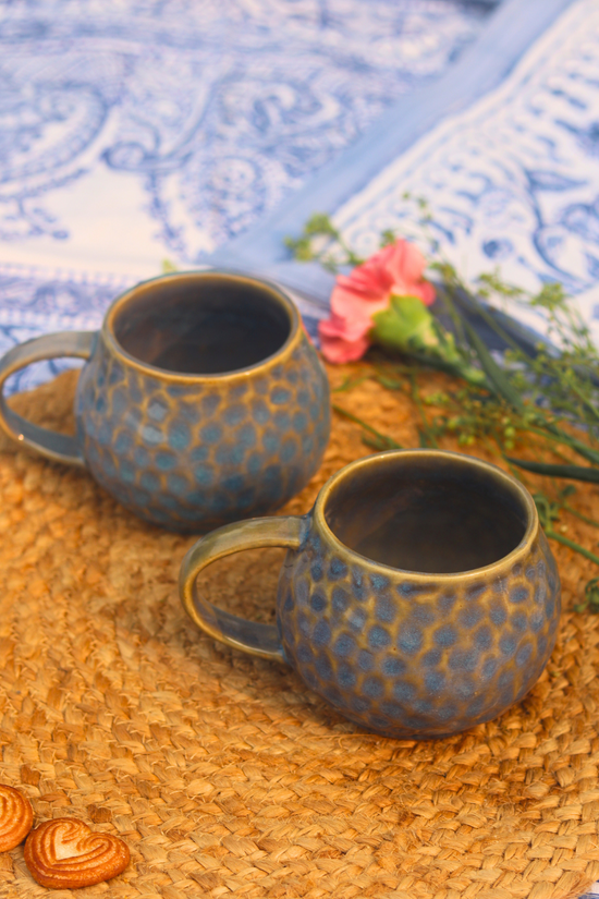 Two ceramic honeycomb mugs 