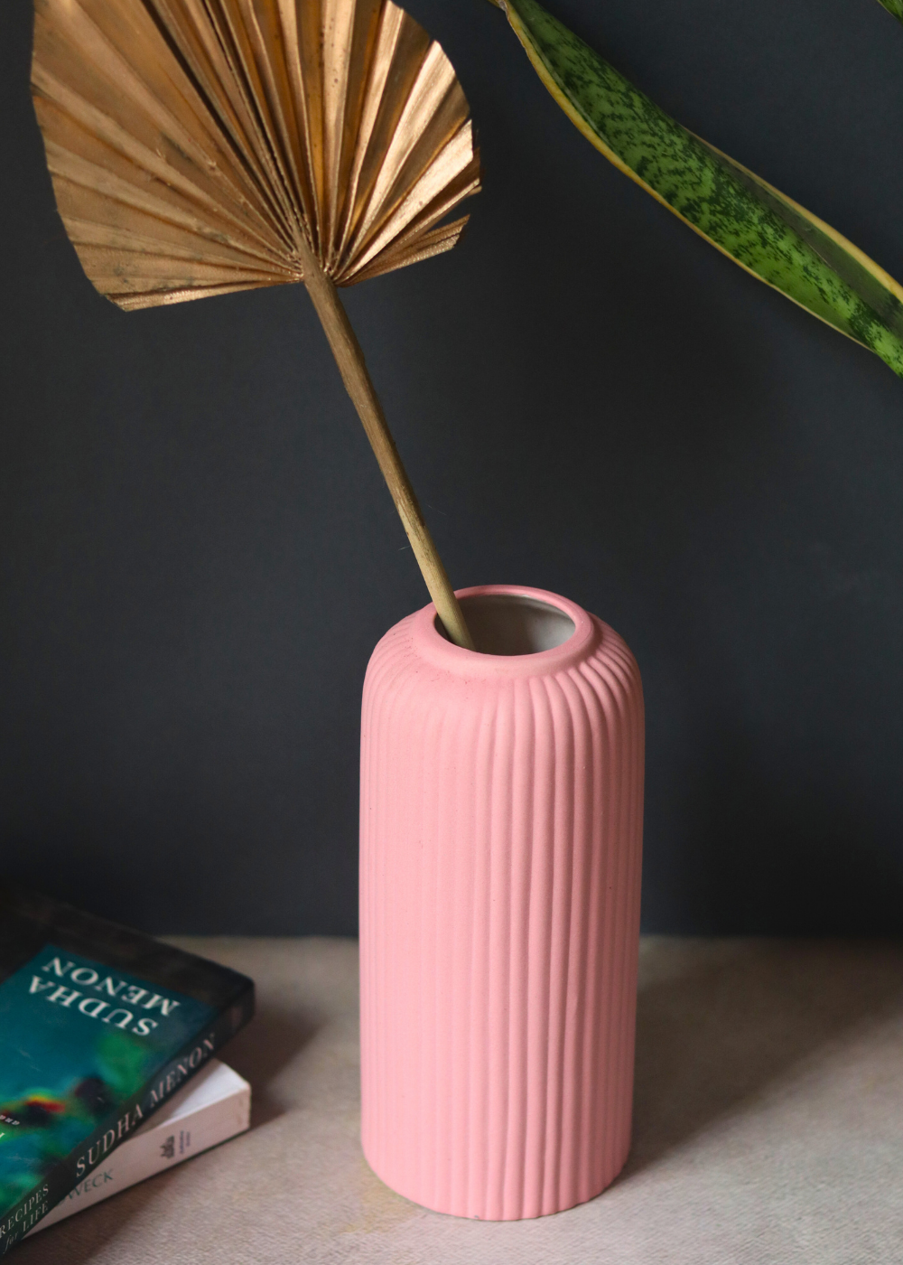 Pink ribbed ceramic vase for home decoration