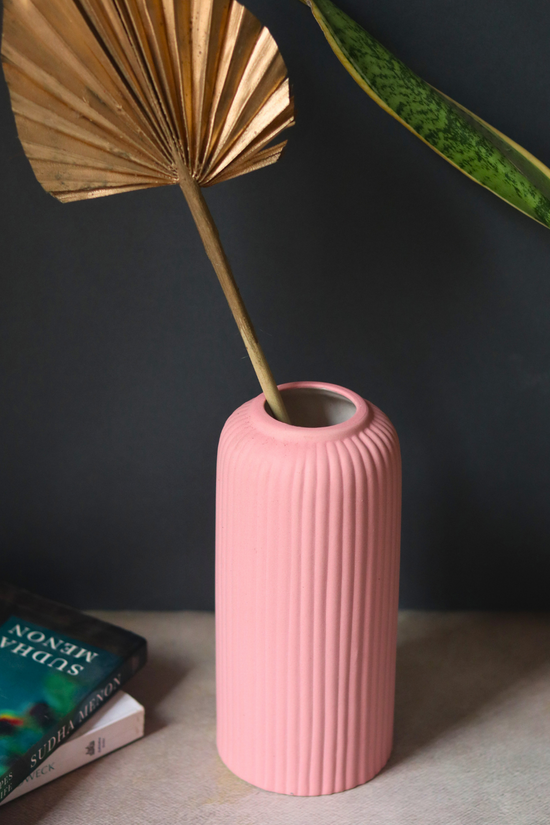 Pink ribbed ceramic vase for home decoration