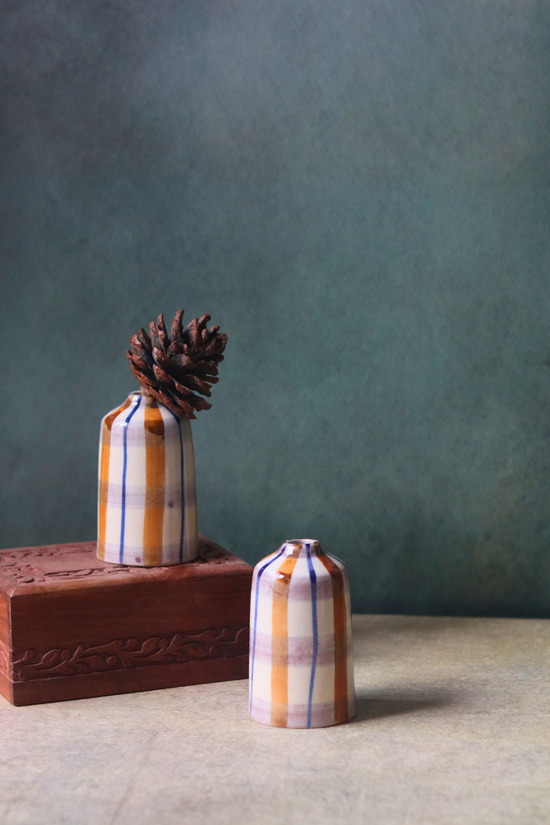 chequered bud vase tall on wood