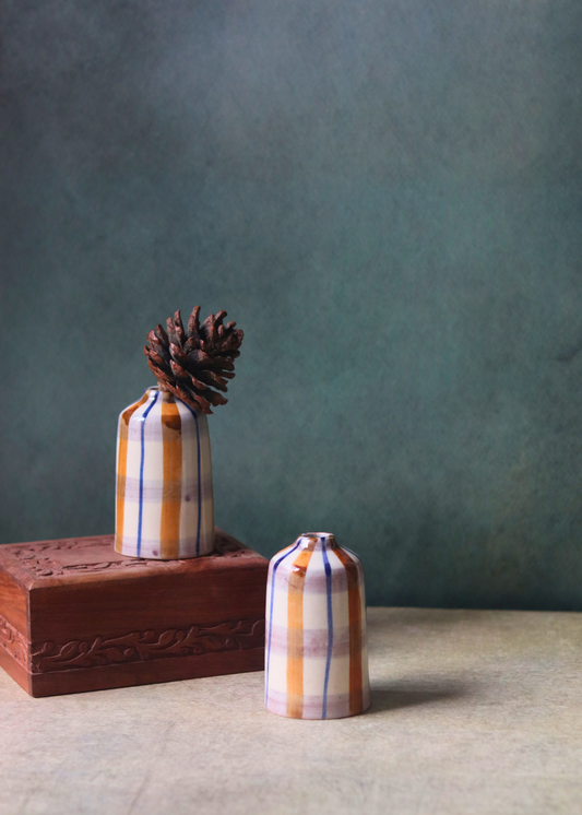 chequered bud vase tall on wood