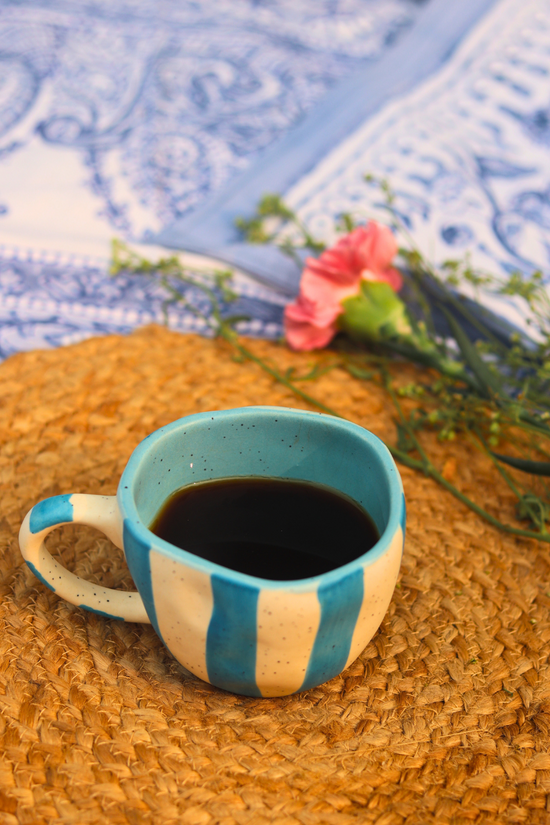 Handmade ceramic mug with tea 