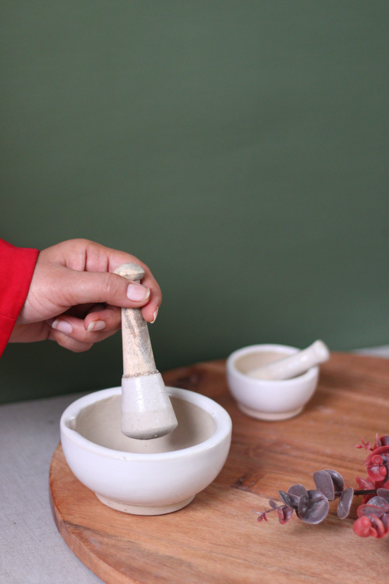 Kitchenware marble mortar & pestle in hand 