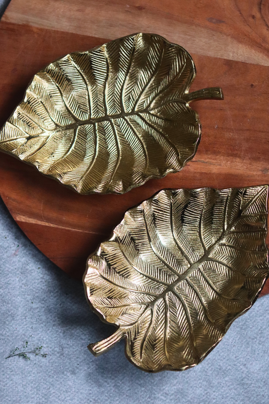 Two handmade metal bowls palm leaf design