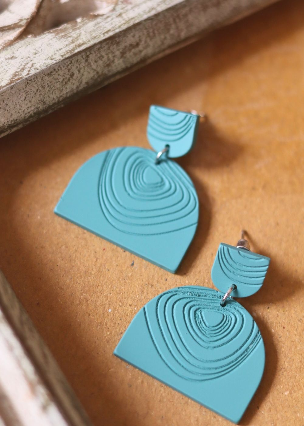 Serene Teal Earrings made by plastic