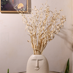 Dried natural bunch in white vase