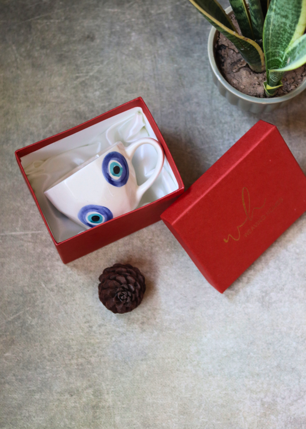 Handmade ceramic coffee mug in gift box