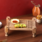 Wooden charpai serving tray with snacks 