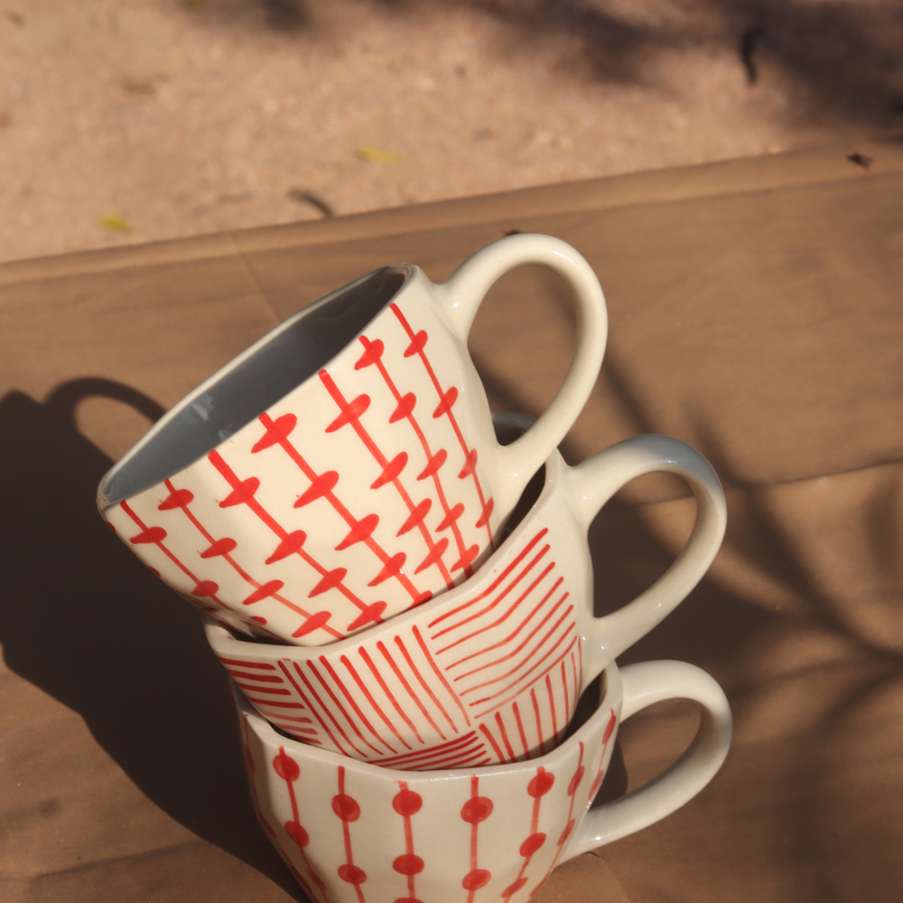handmade red patterned mugs 