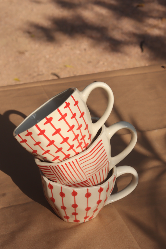 handmade red patterned mugs 