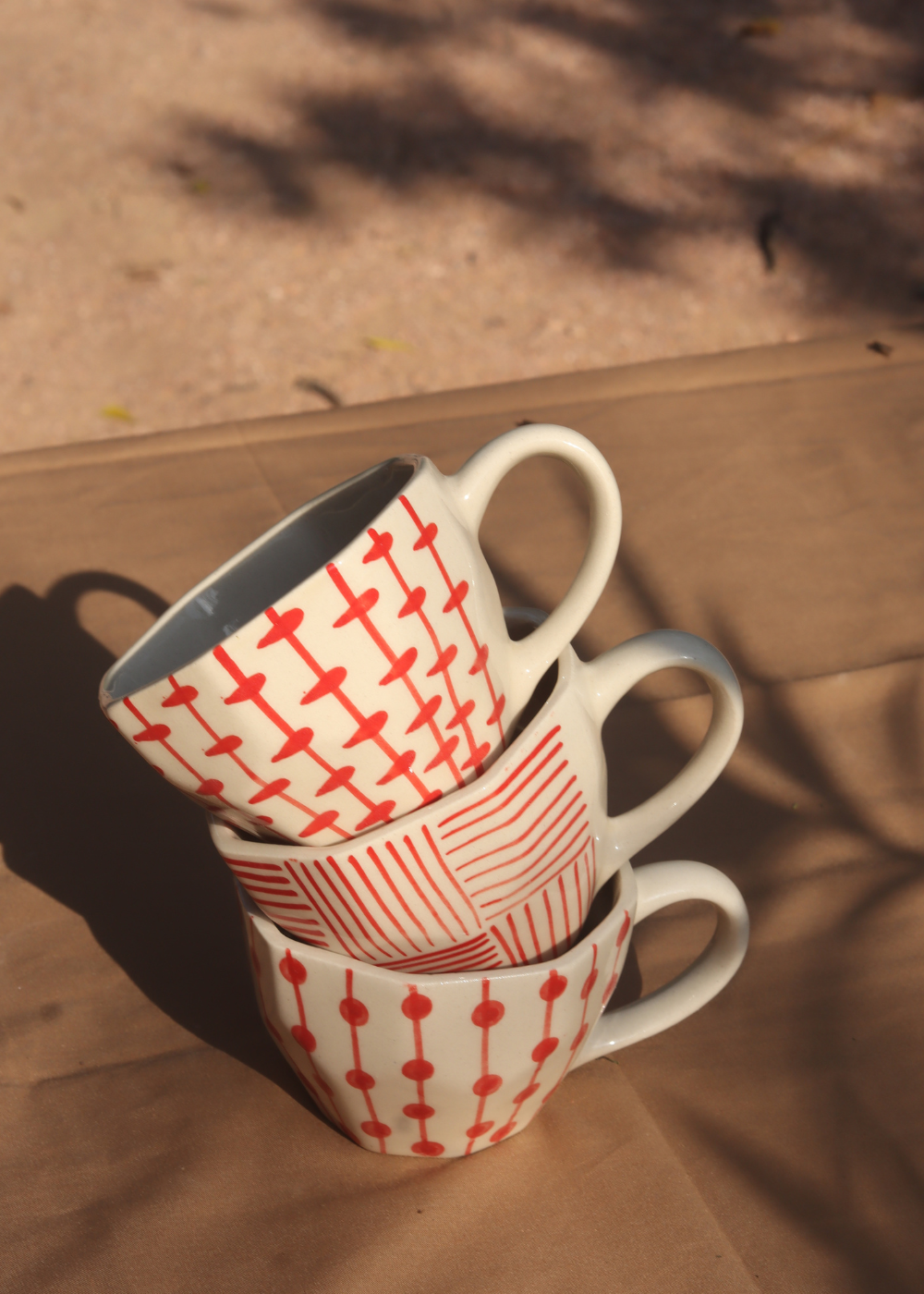 handmade red patterned mugs 