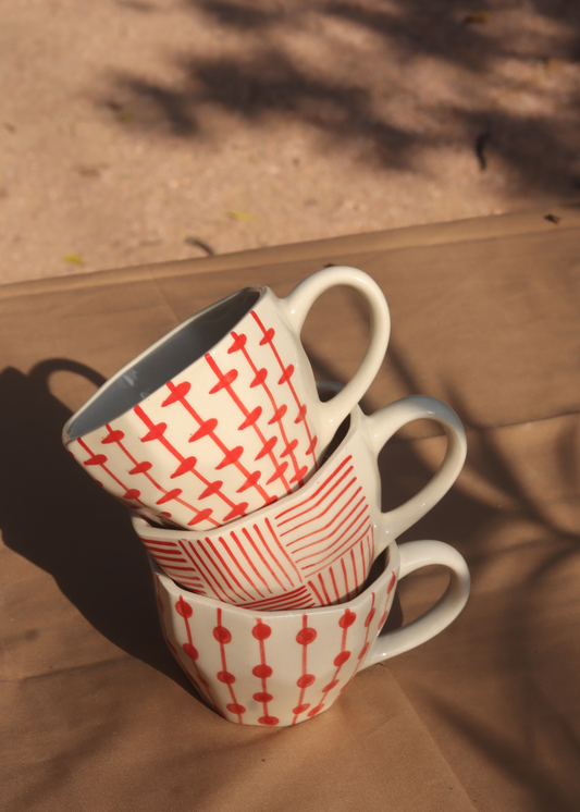 handmade red patterned mugs 