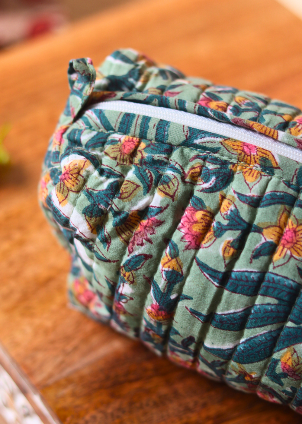 Closeup shot of green floral toiletry bag