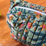 Closeup shot of green floral toiletry bag