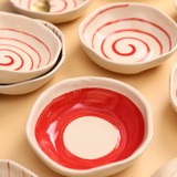 Red and white handmade ceramic bowls