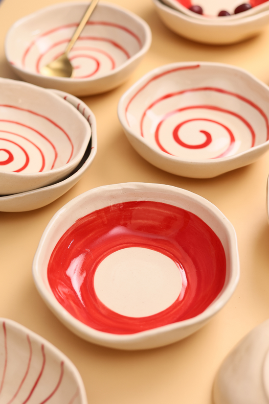 Red and white handmade ceramic bowls