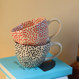red & black polka mugs with red & black small polka design 