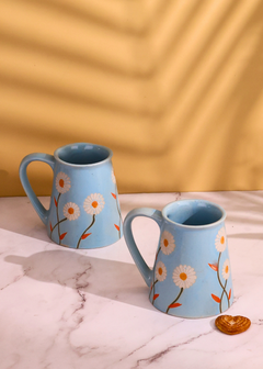 Blue spring coffee mug with a biscuit