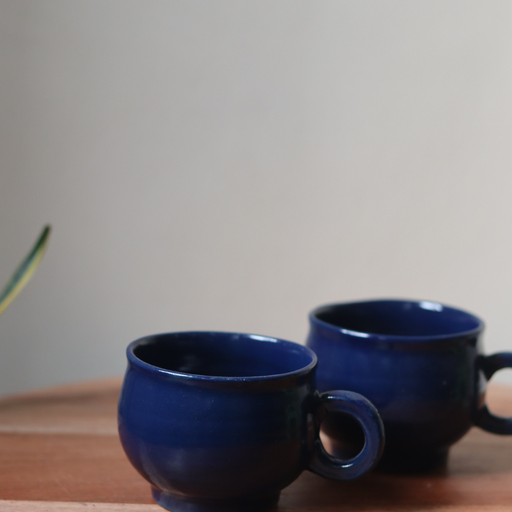 Bright blue coffee mug on wooden surface