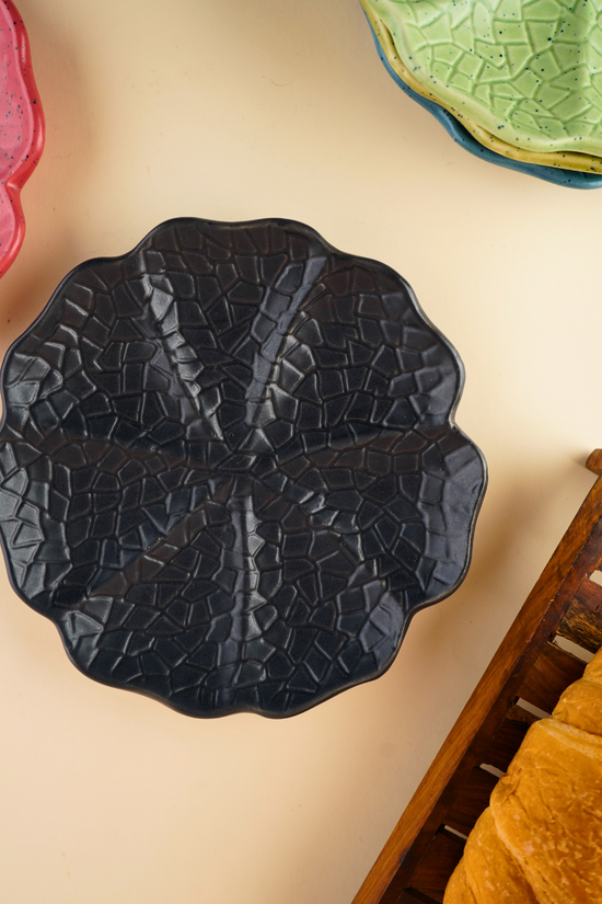 black cabbage snack plate with cabbage leaf design