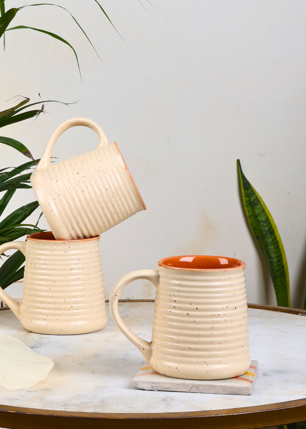 Three handmade ceramic coffee mugs 