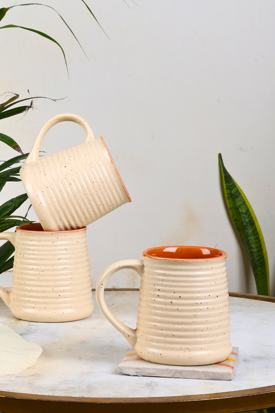 Three handmade ceramic coffee mugs 