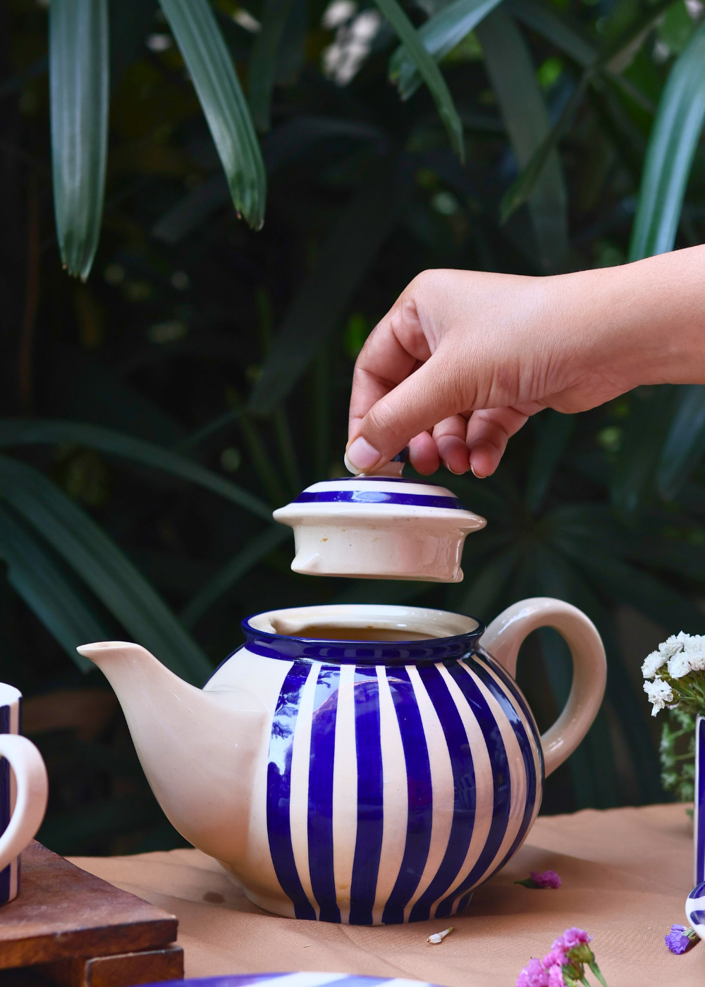 teo pot with blue stripes on it