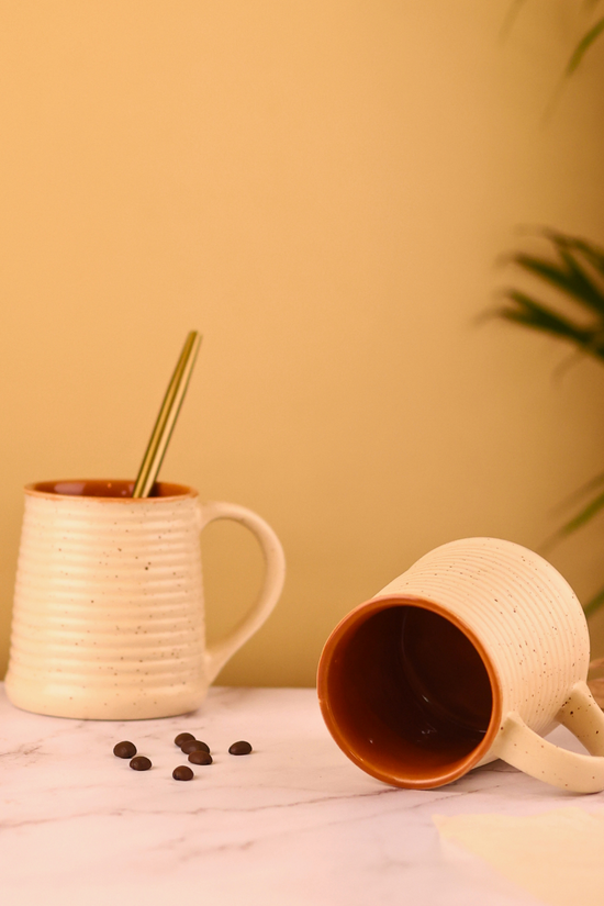 Cream coffee mug with speckled on it