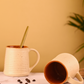 cream coffee mug with speckled on it