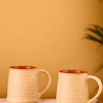 Two cream speckled coffee mug 
