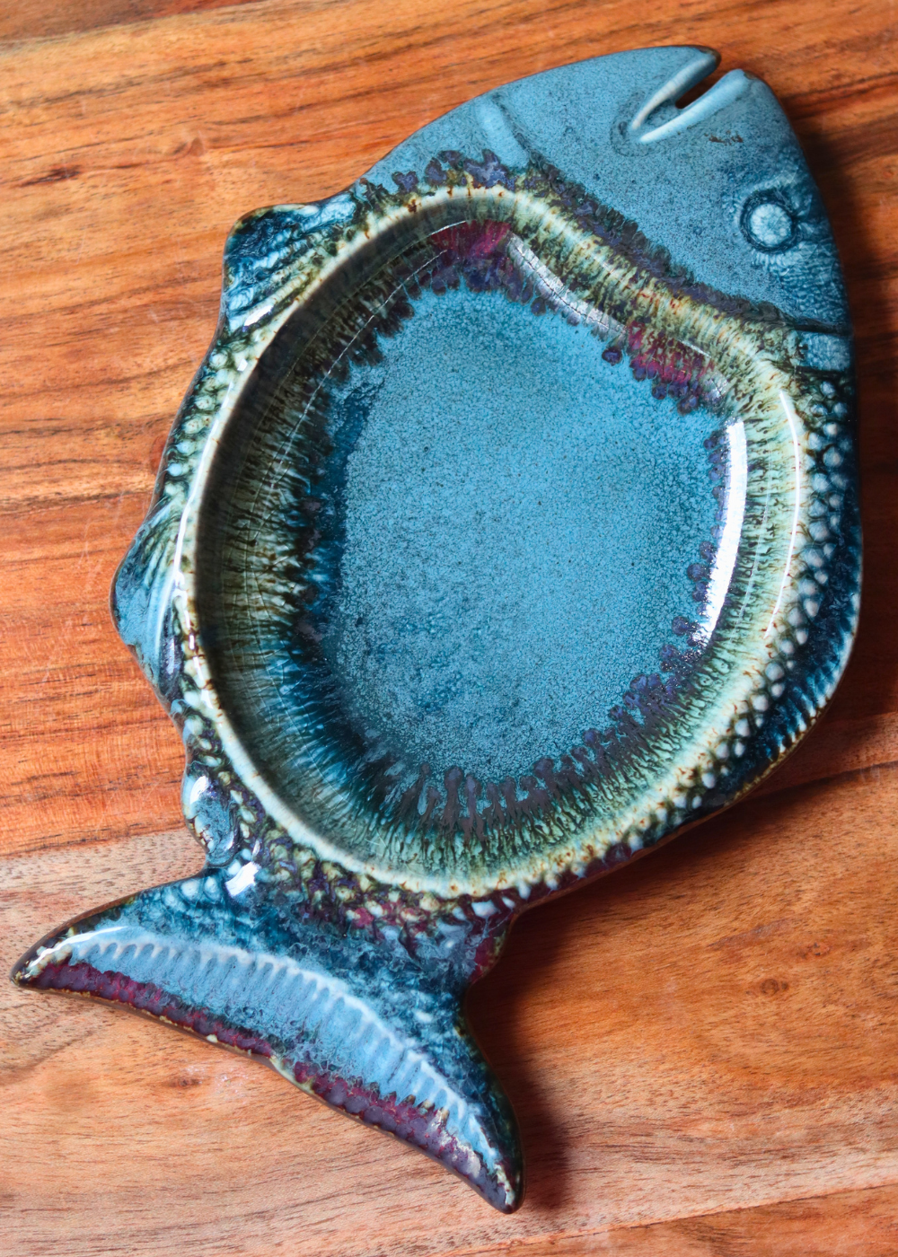 Blue fish platter on a wooden surface