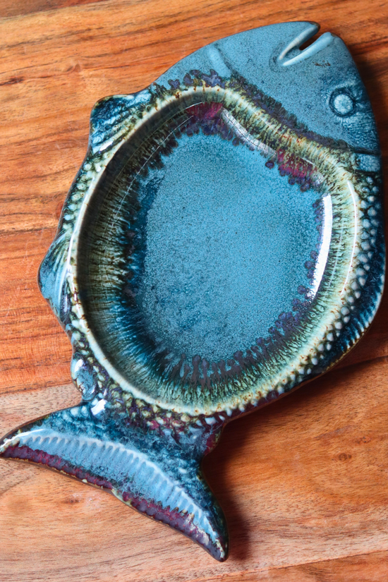 Blue fish platter on a wooden surface