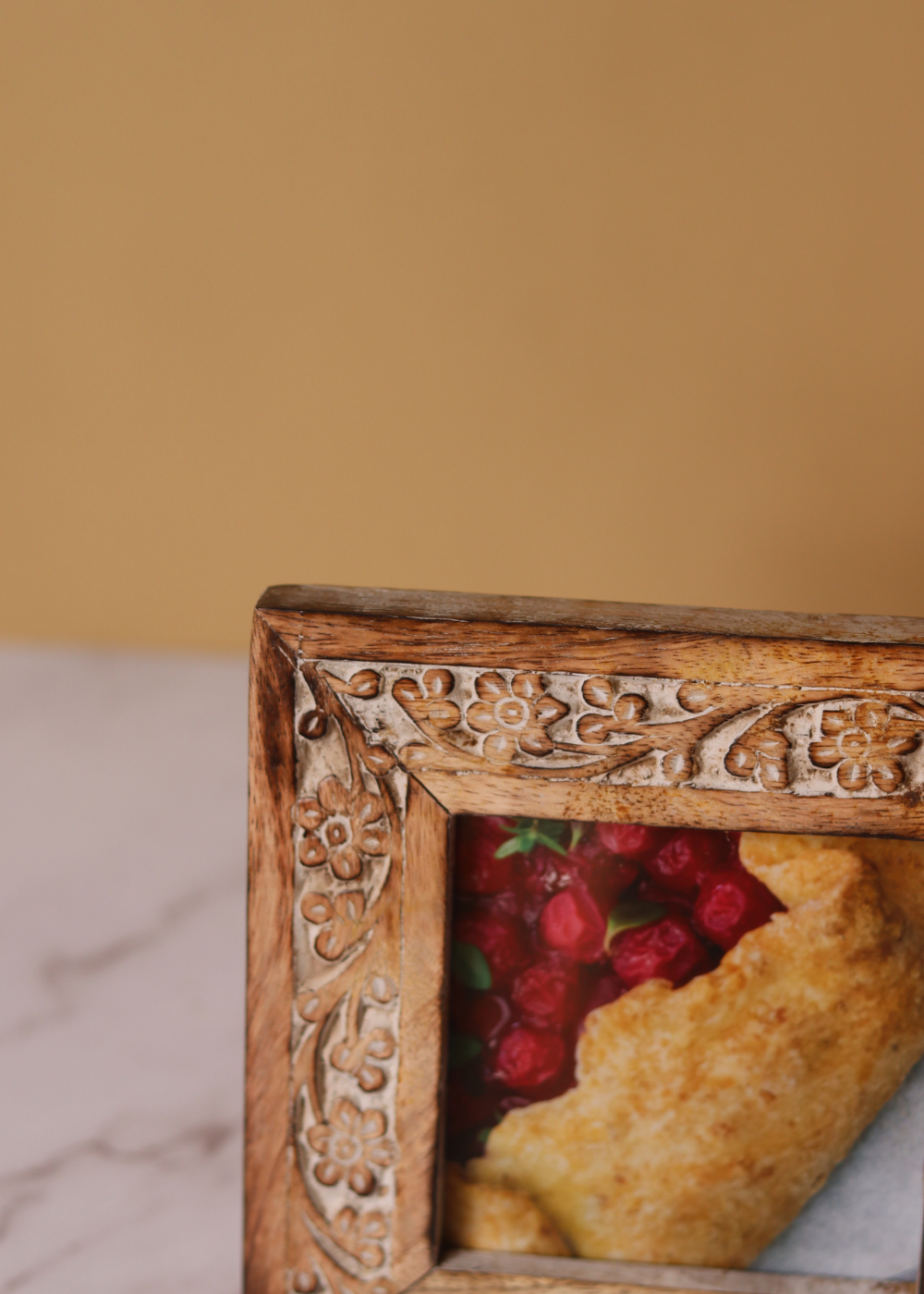 Carved floral wooden frame closeup