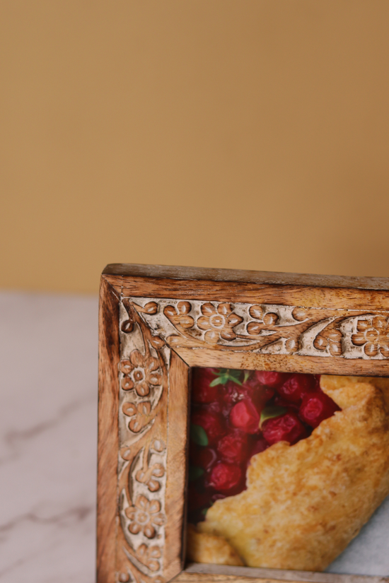 Carved floral wooden frame closeup