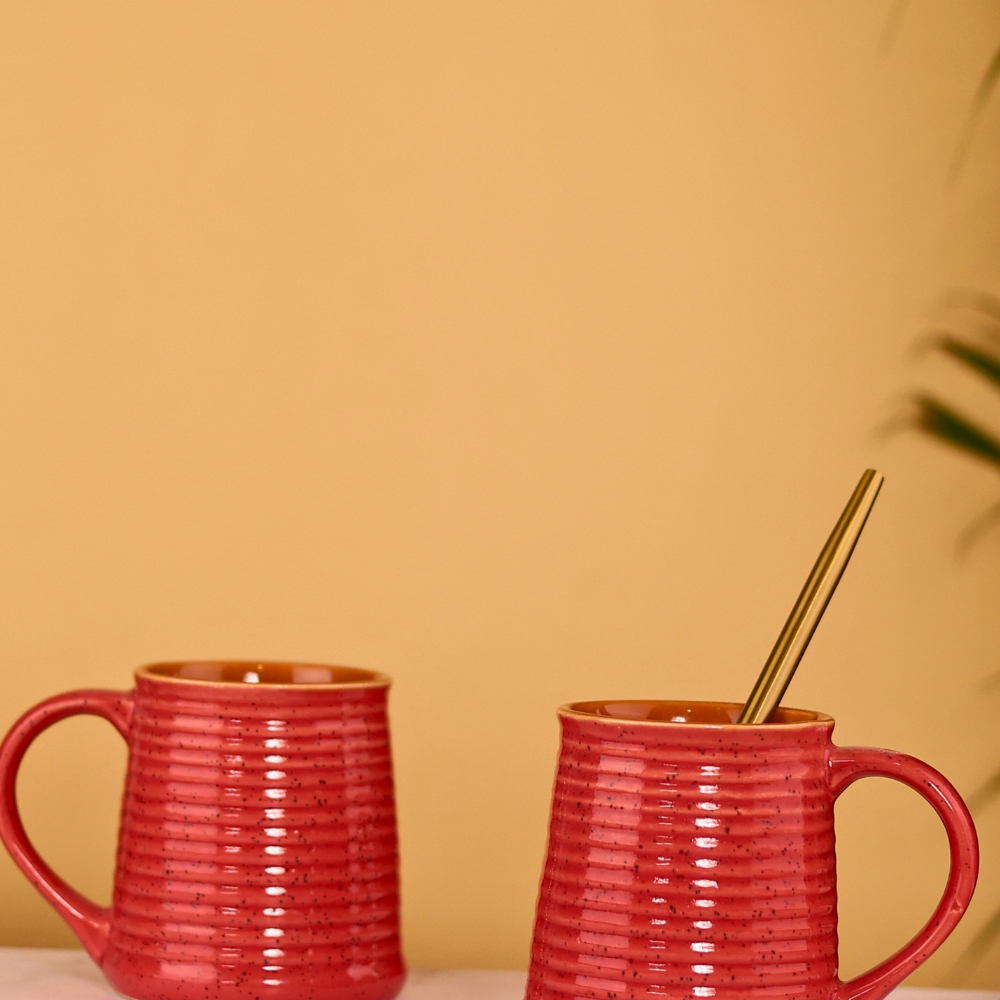 Two red glossy coffee mugs 