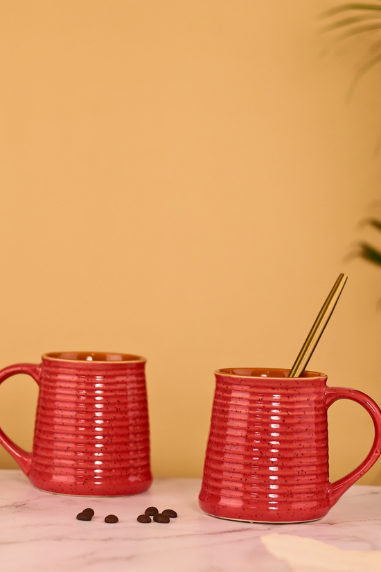 Two red glossy coffee mugs 