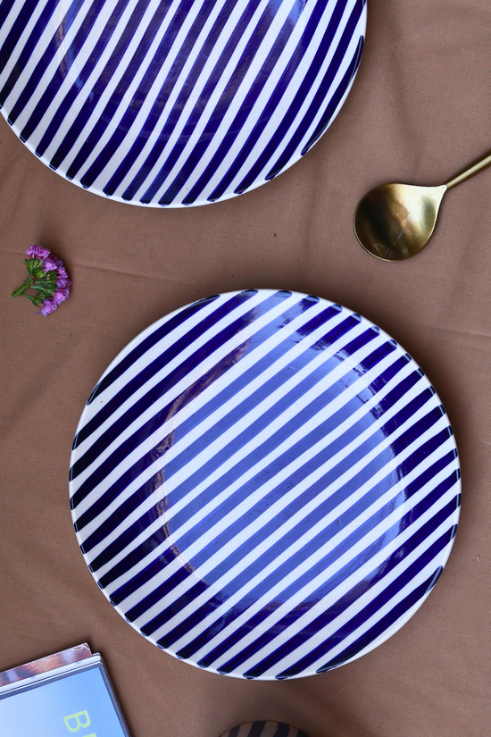 Two ceramic plates with spoon