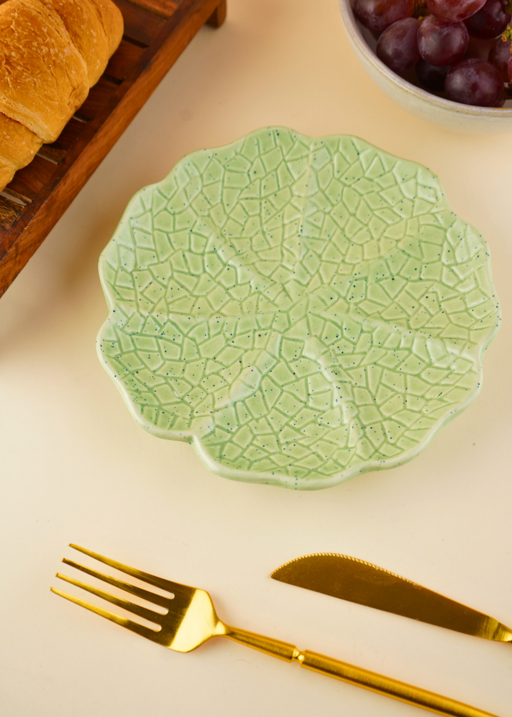 sage green cabbage snack plate with cabbage leaf design