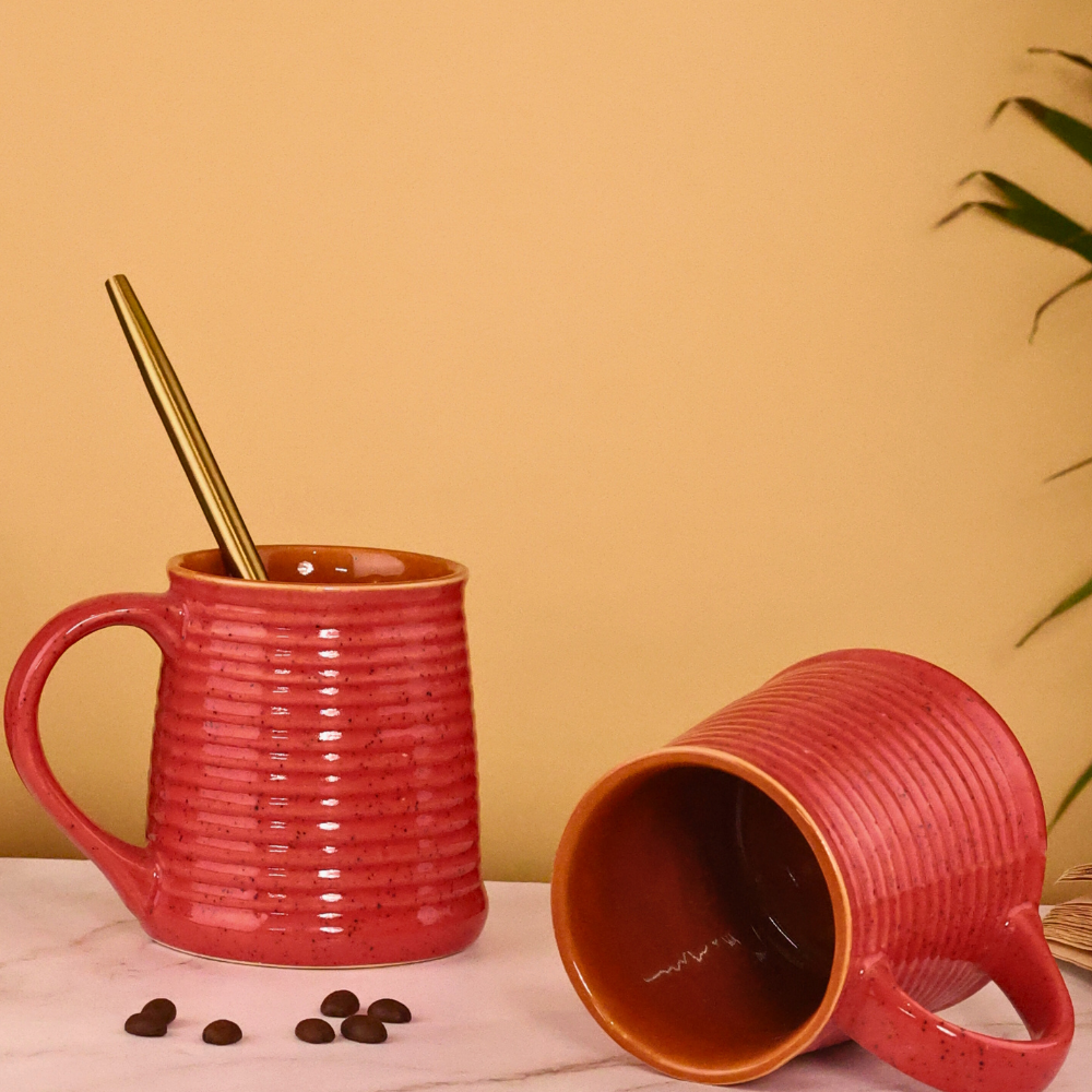 Glossy red coffee mug with spoon 